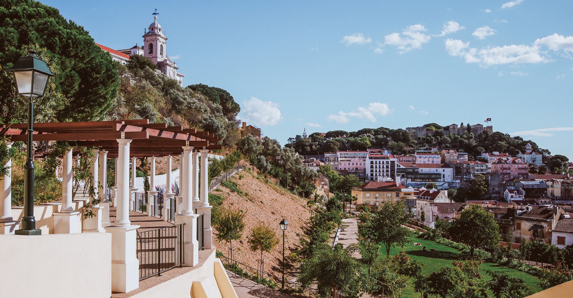 Relax in Jardim da Cerca da Graça, a hidden green oasis with stunning views of Lisbon’s rooftops.